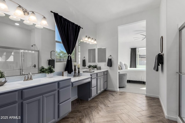 bathroom featuring parquet flooring, vanity, and a shower with door