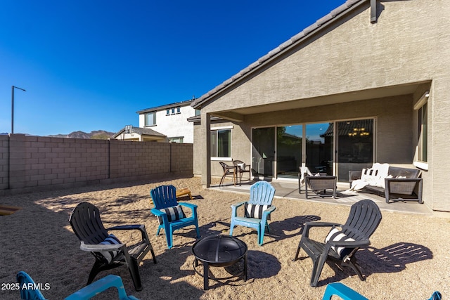 view of patio / terrace with an outdoor fire pit