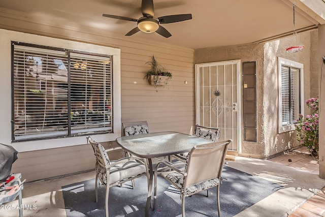 view of patio / terrace featuring outdoor dining space and ceiling fan