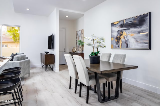 dining space featuring light hardwood / wood-style floors