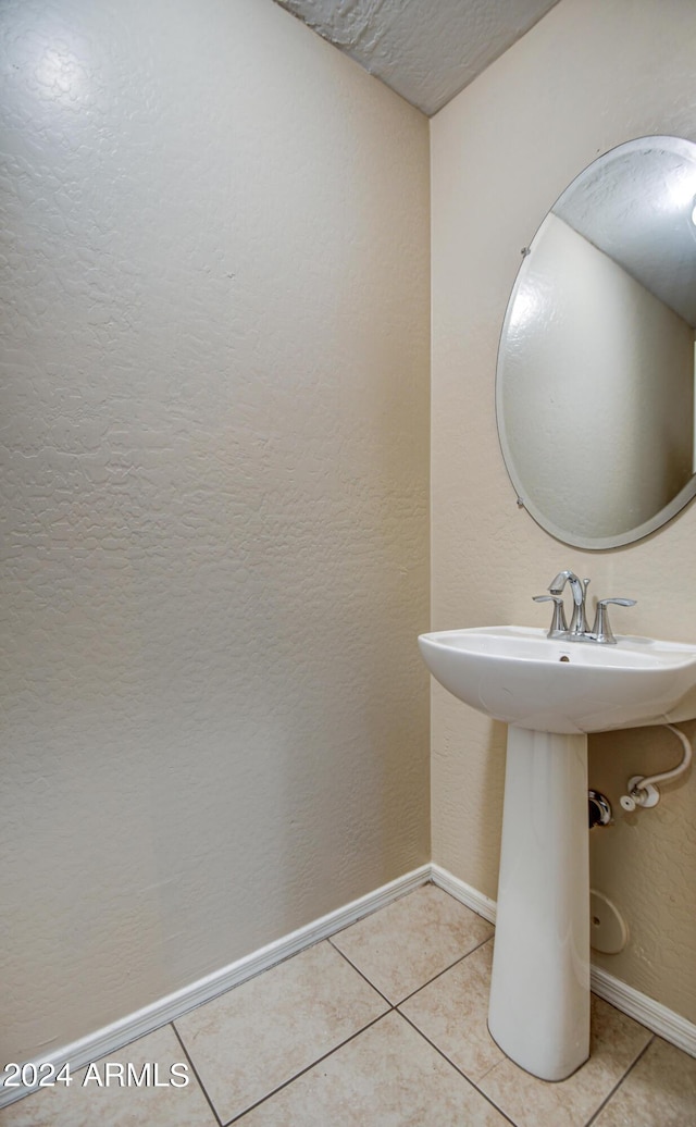 bathroom with tile patterned floors