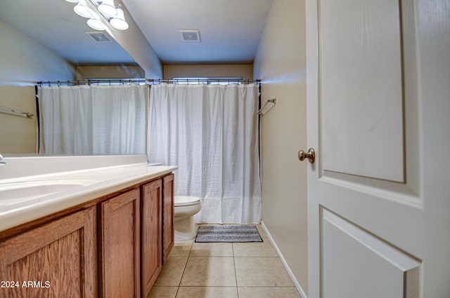 bathroom with tile patterned flooring, vanity, toilet, and a shower with shower curtain