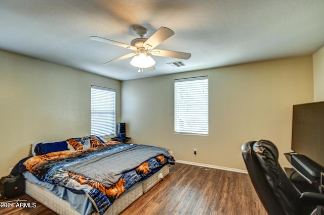 bedroom featuring dark hardwood / wood-style floors and ceiling fan