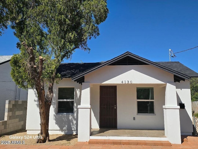 4130 N Longview Ave, Phoenix, AZ 85014 - view of front of property with a shingled roof and stucco siding