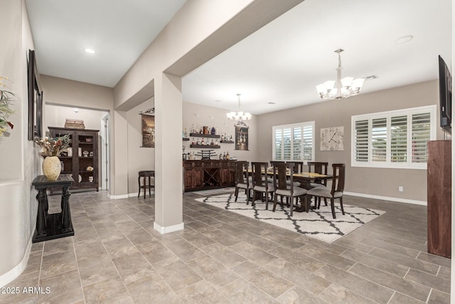 dining room with a notable chandelier