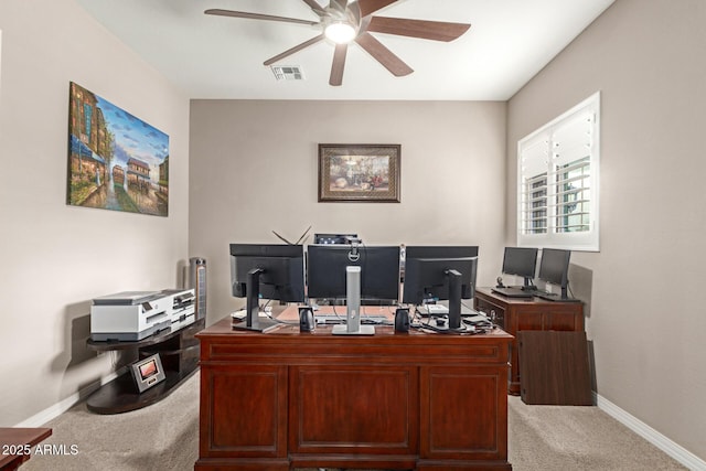 office space with ceiling fan and light colored carpet