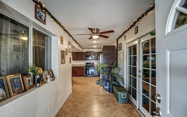 interior space featuring ceiling fan