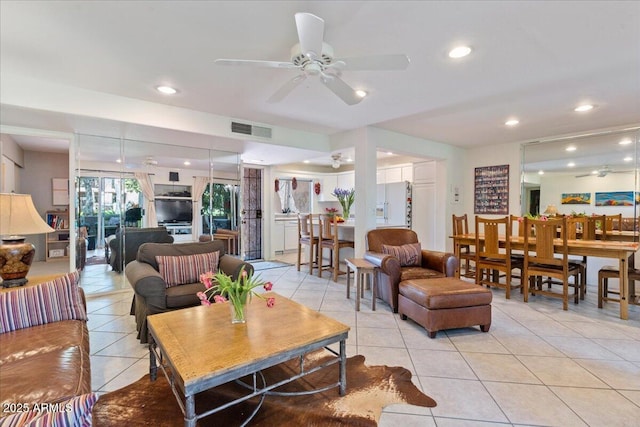 living area featuring recessed lighting, light tile patterned floors, a ceiling fan, and visible vents