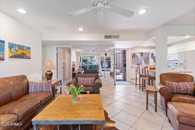 living area featuring a ceiling fan, light tile patterned flooring, recessed lighting, and visible vents