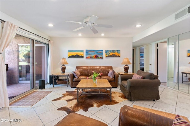 living room with light tile patterned flooring, visible vents, recessed lighting, and a ceiling fan