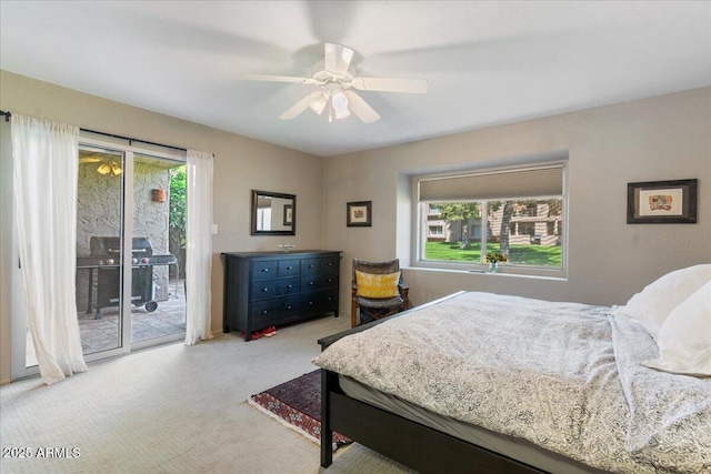 carpeted bedroom with multiple windows, ceiling fan, and access to outside