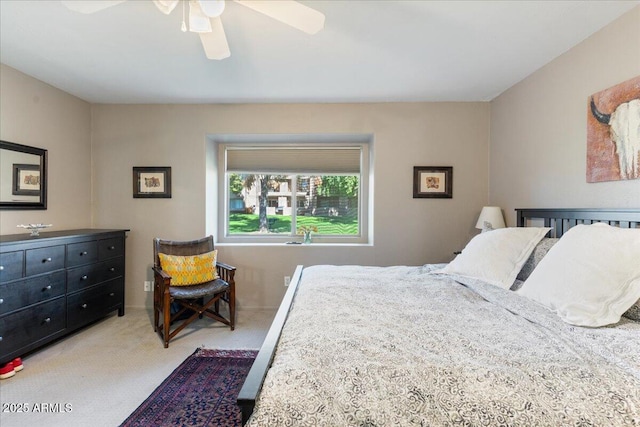 bedroom featuring a ceiling fan and carpet