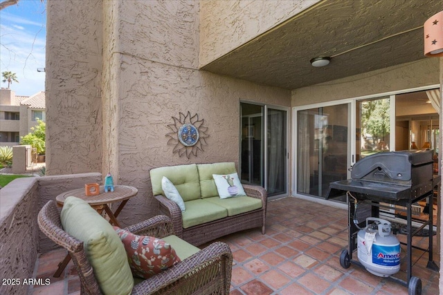 view of patio with area for grilling and an outdoor living space