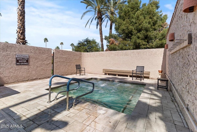 view of pool with a patio area and a fenced backyard