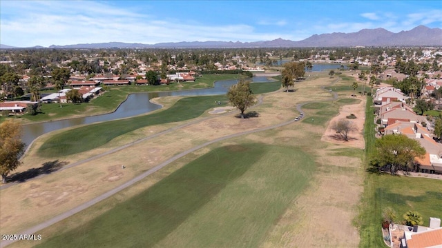 bird's eye view featuring golf course view, a residential view, and a water and mountain view