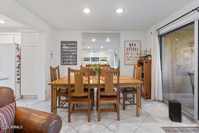 dining area with light tile patterned flooring and recessed lighting