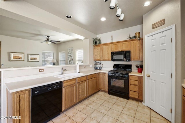 kitchen with light countertops, light tile patterned flooring, a sink, a peninsula, and black appliances