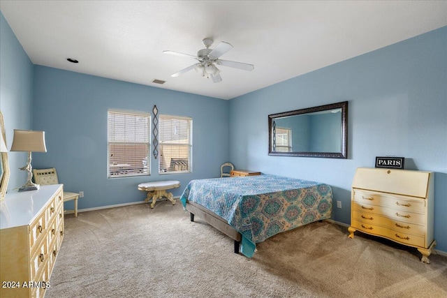 carpeted bedroom featuring visible vents, ceiling fan, and baseboards
