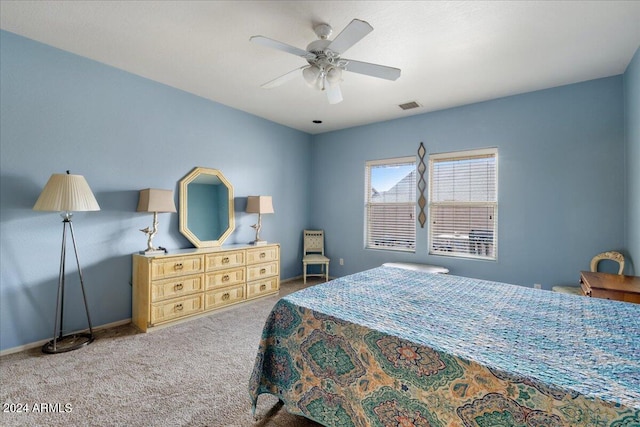 bedroom with baseboards, visible vents, ceiling fan, and carpet flooring