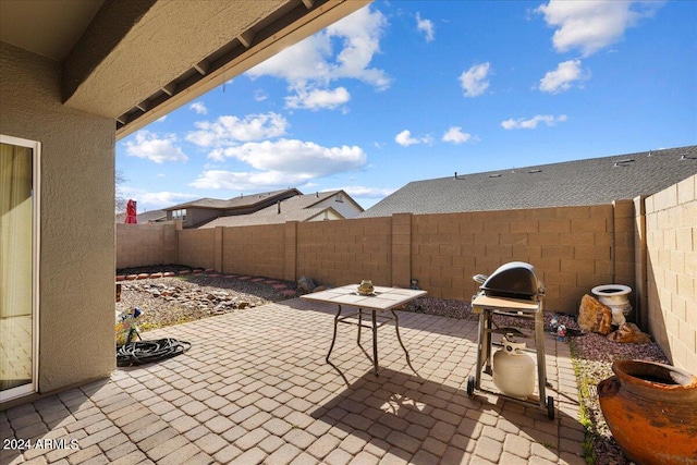 view of patio featuring a grill and a fenced backyard