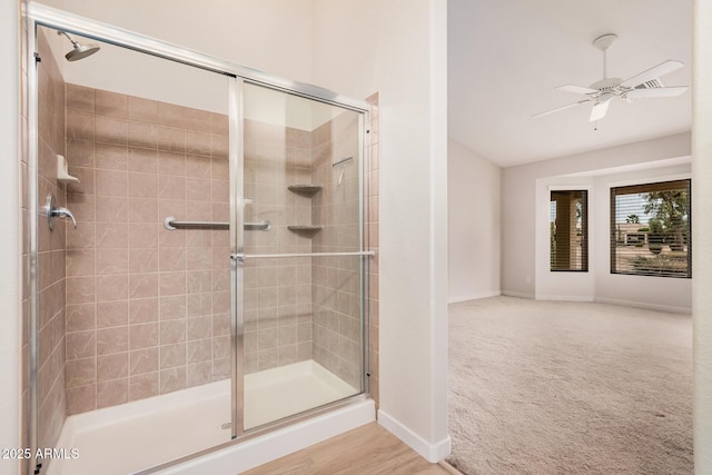3582 N 160th Ave, Goodyear, AZ 85395 - bathroom with a stall shower, baseboards, and ceiling fan