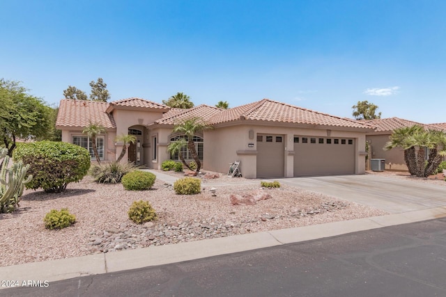 3582 N 160th Ave, Goodyear, AZ 85395 - mediterranean / spanish house with a garage, driveway, stucco siding, a tile roof, and central air condition unit