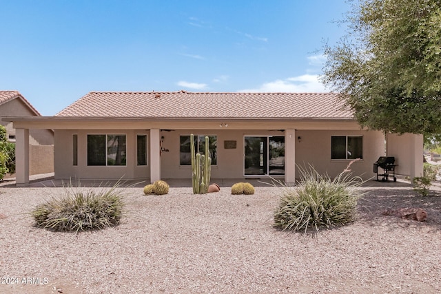 back of house with a patio