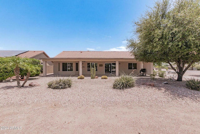 3582 N 160th Ave, Goodyear, AZ 85395 - rear view of property with a tile roof, stucco siding, and a patio