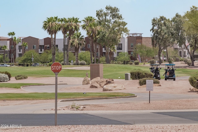 view of home's community featuring a lawn