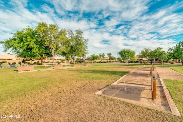 view of property's community with a lawn