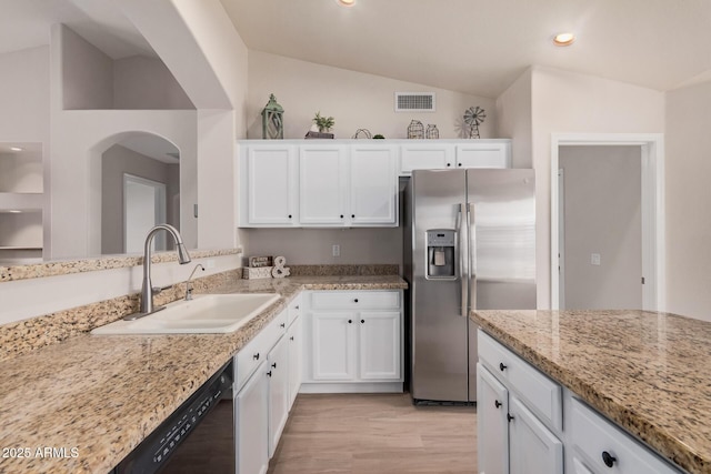 3582 N 160th Ave, Goodyear, AZ 85395 - kitchen featuring stainless steel refrigerator with ice dispenser, a sink, black dishwasher, white cabinetry, and lofted ceiling