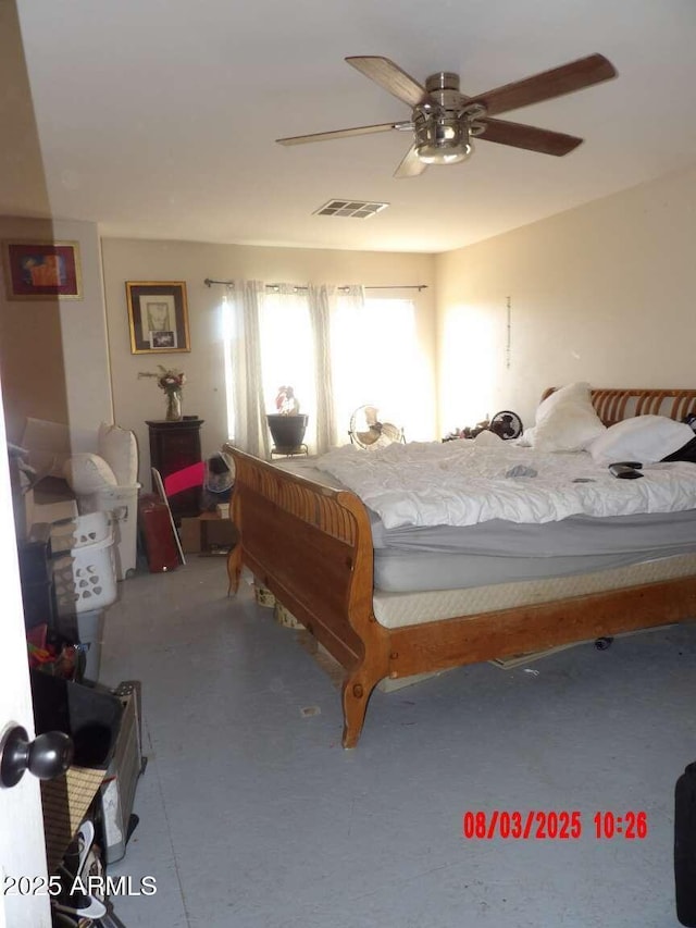 bedroom with visible vents and a ceiling fan