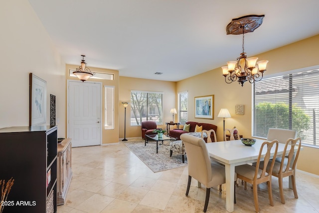 5014 E Kirkland Rd, Phoenix, AZ 85054 - dining space featuring a chandelier, healthy amount of natural light, and baseboards