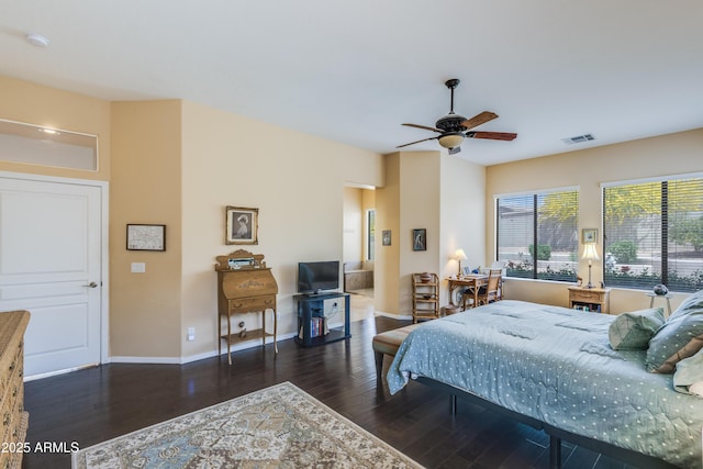 5014 E Kirkland Rd, Phoenix, AZ 85054 - bedroom with wood finished floors, baseboards, and a ceiling fan
