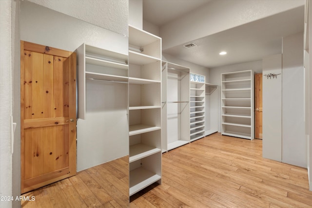 spacious closet with light wood-type flooring