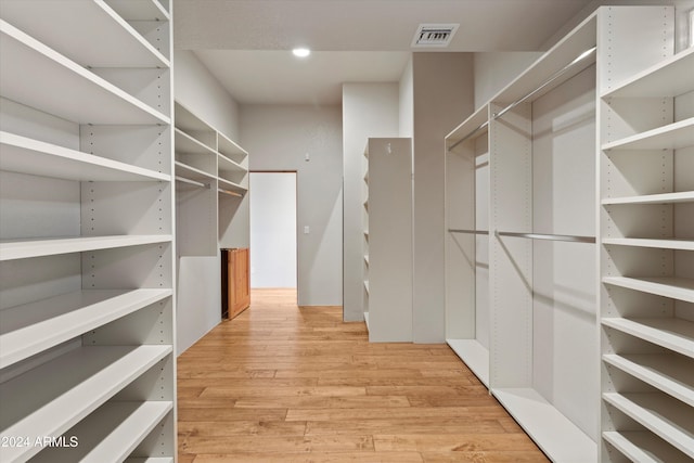 spacious closet featuring light wood-type flooring