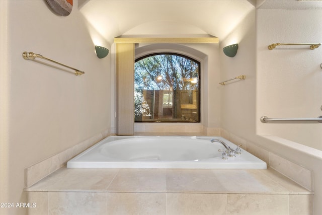 bathroom with tiled tub