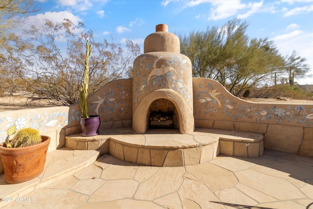 view of patio / terrace with an outdoor fireplace