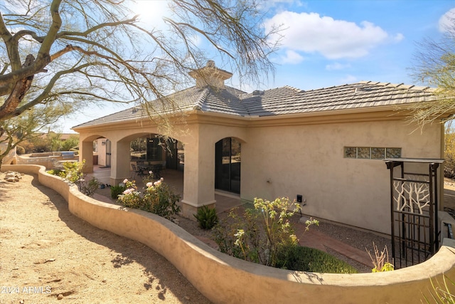 view of home's exterior with a patio area