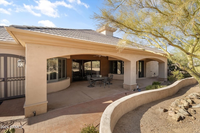 back of house with a patio area