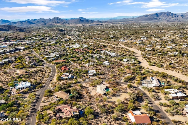 birds eye view of property featuring a mountain view