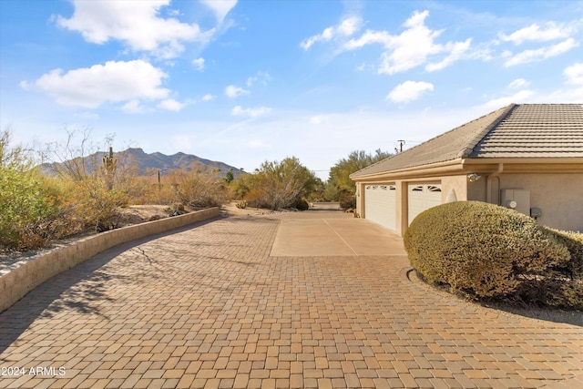 view of property exterior featuring a mountain view