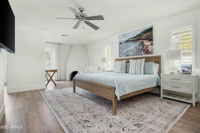 bedroom with light wood-type flooring and ceiling fan