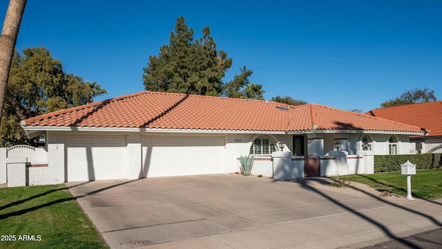 mediterranean / spanish-style house with a garage