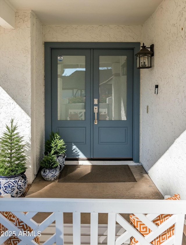 entrance to property featuring french doors