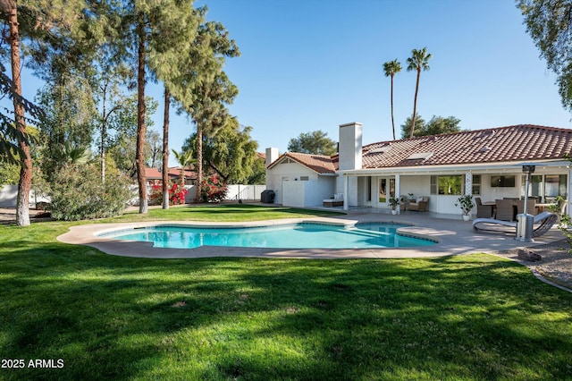 view of swimming pool with an outdoor living space, a yard, and a patio