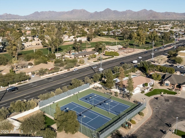 birds eye view of property with a mountain view