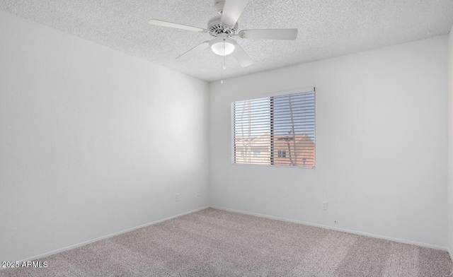 3511 E Baseline Rd Unit 1235, Phoenix, AZ 85042 - empty room with carpet flooring, a textured ceiling, a ceiling fan, and baseboards