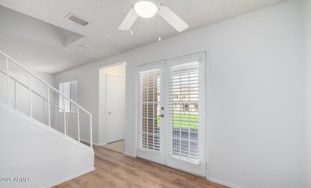 3511 E Baseline Rd Unit 1235, Phoenix, AZ 85042 - entryway featuring a textured ceiling, a ceiling fan, wood finished floors, and baseboards