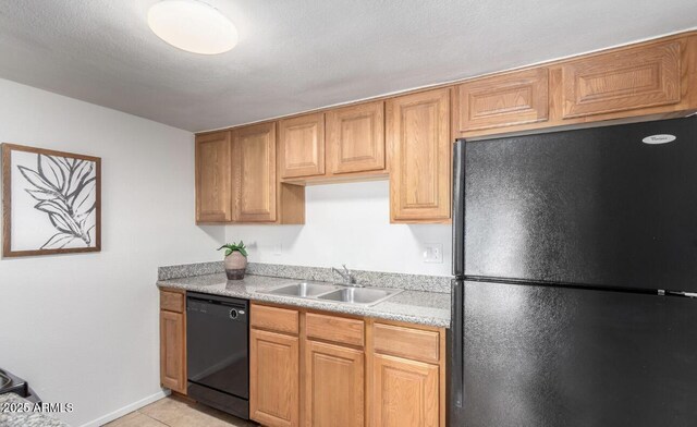 3511 E Baseline Rd Unit 1235, Phoenix, AZ 85042 - kitchen featuring black appliances, a sink, light countertops, light tile patterned flooring, and baseboards